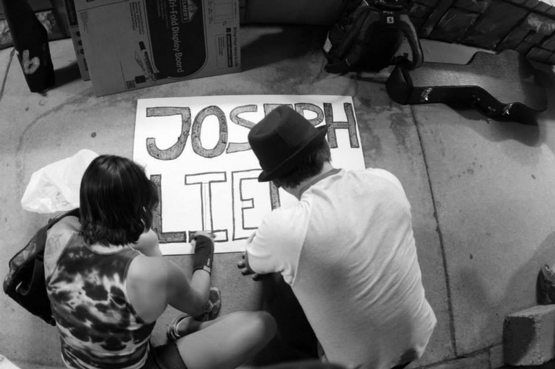 Missionaries making their own JosephLied.com signs
